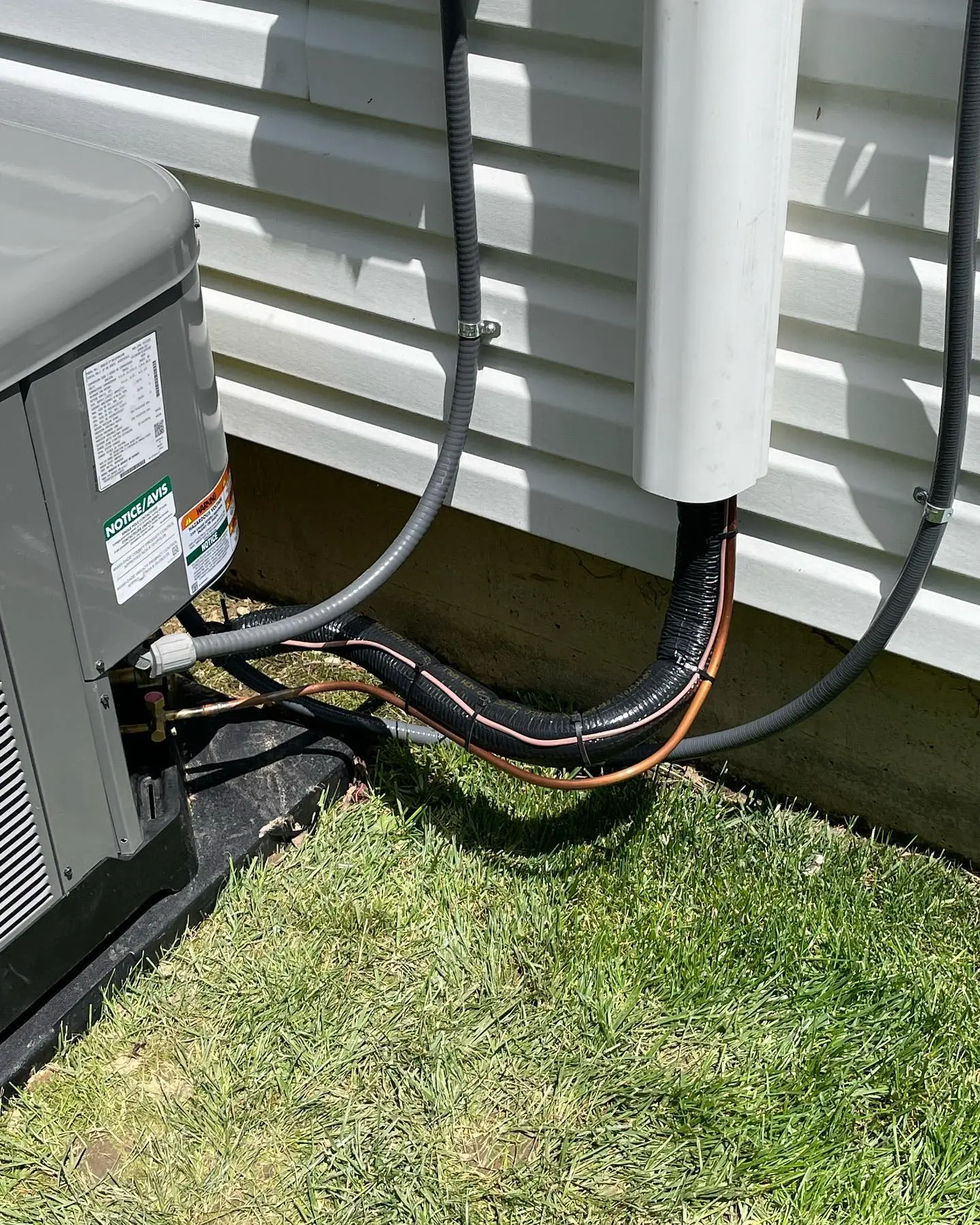 Insulated refrigerant line set running from a new AC condenser in Plainfield, IN