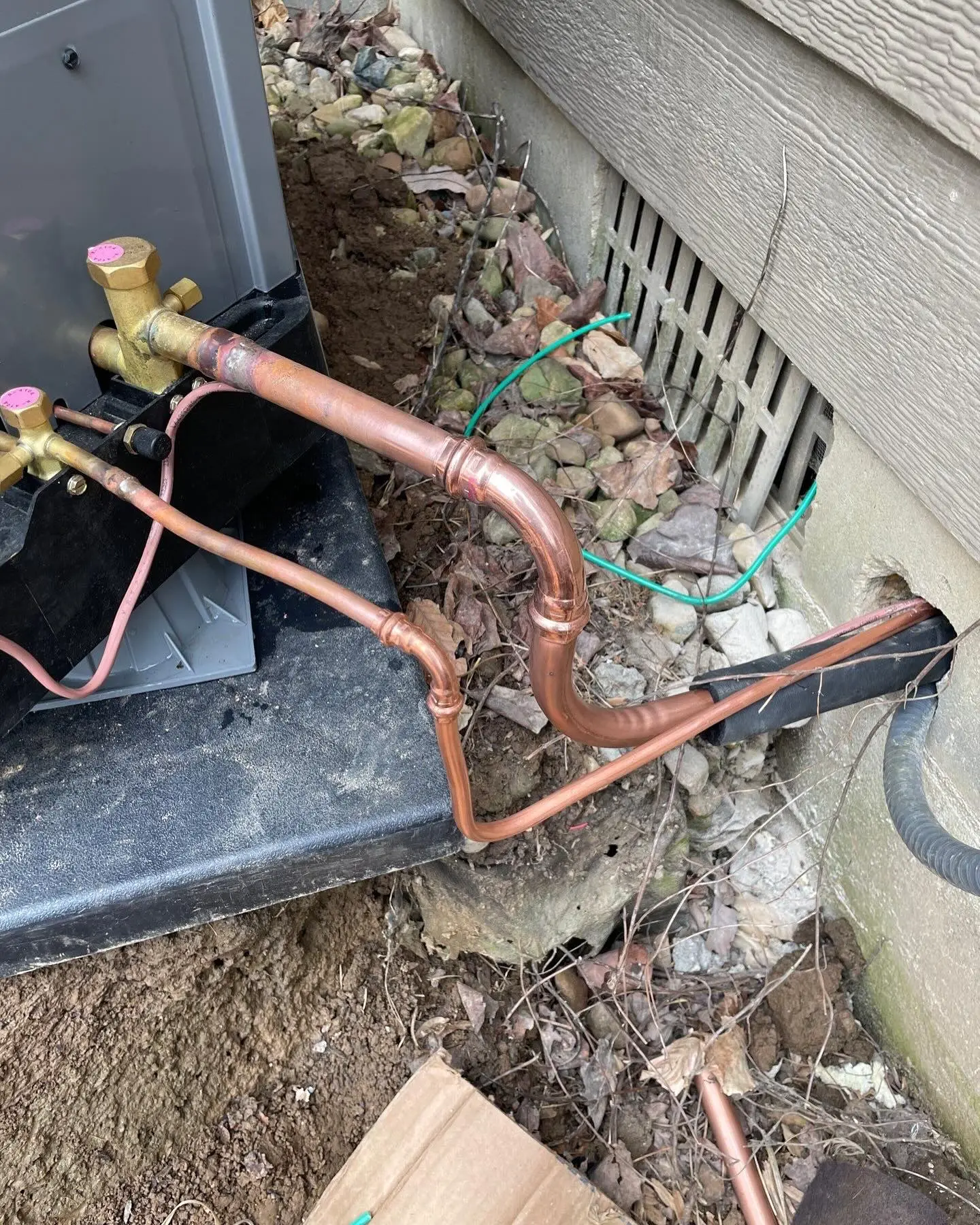 Refrigerant copper lines connected to a heat pump condenser in Plainfield, IN
